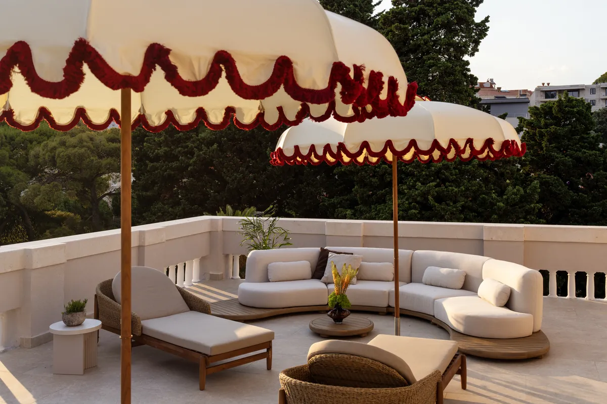 Magnolia Deluxe Terrace Suite — sun-drenched private terrace overlooking the garden